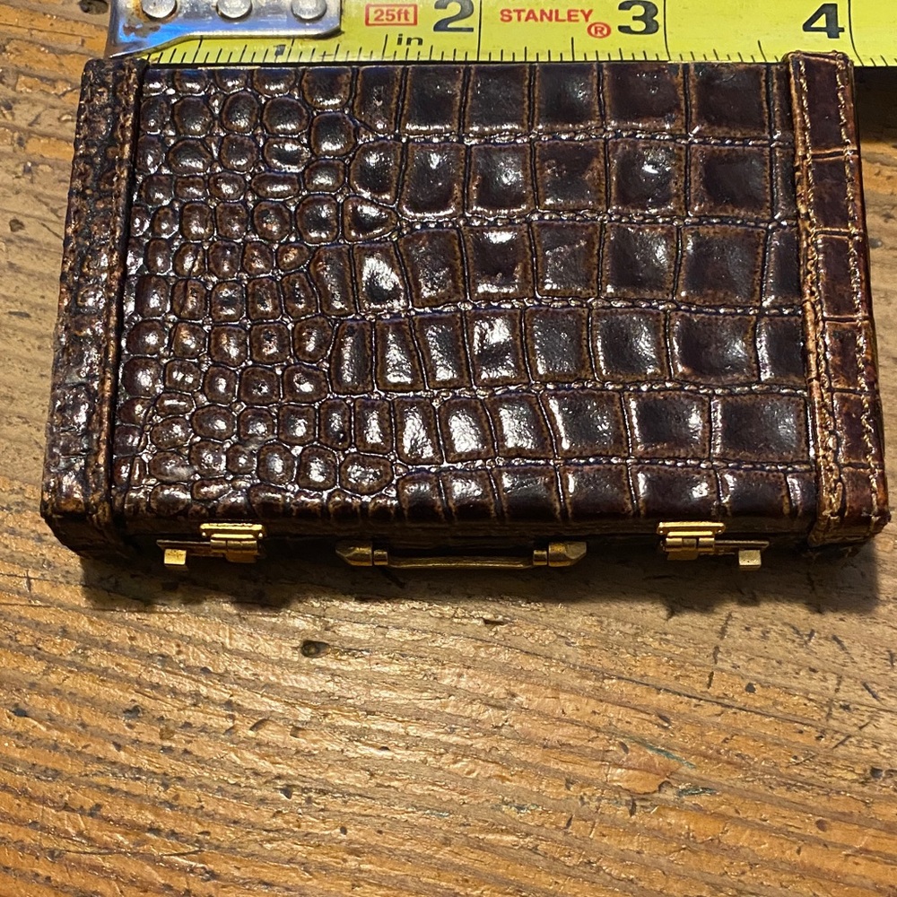 Tiny crocodile card holder.